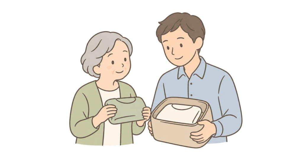 老人ホームへの入居に向けて持っていく衣類を選ぶ親子
